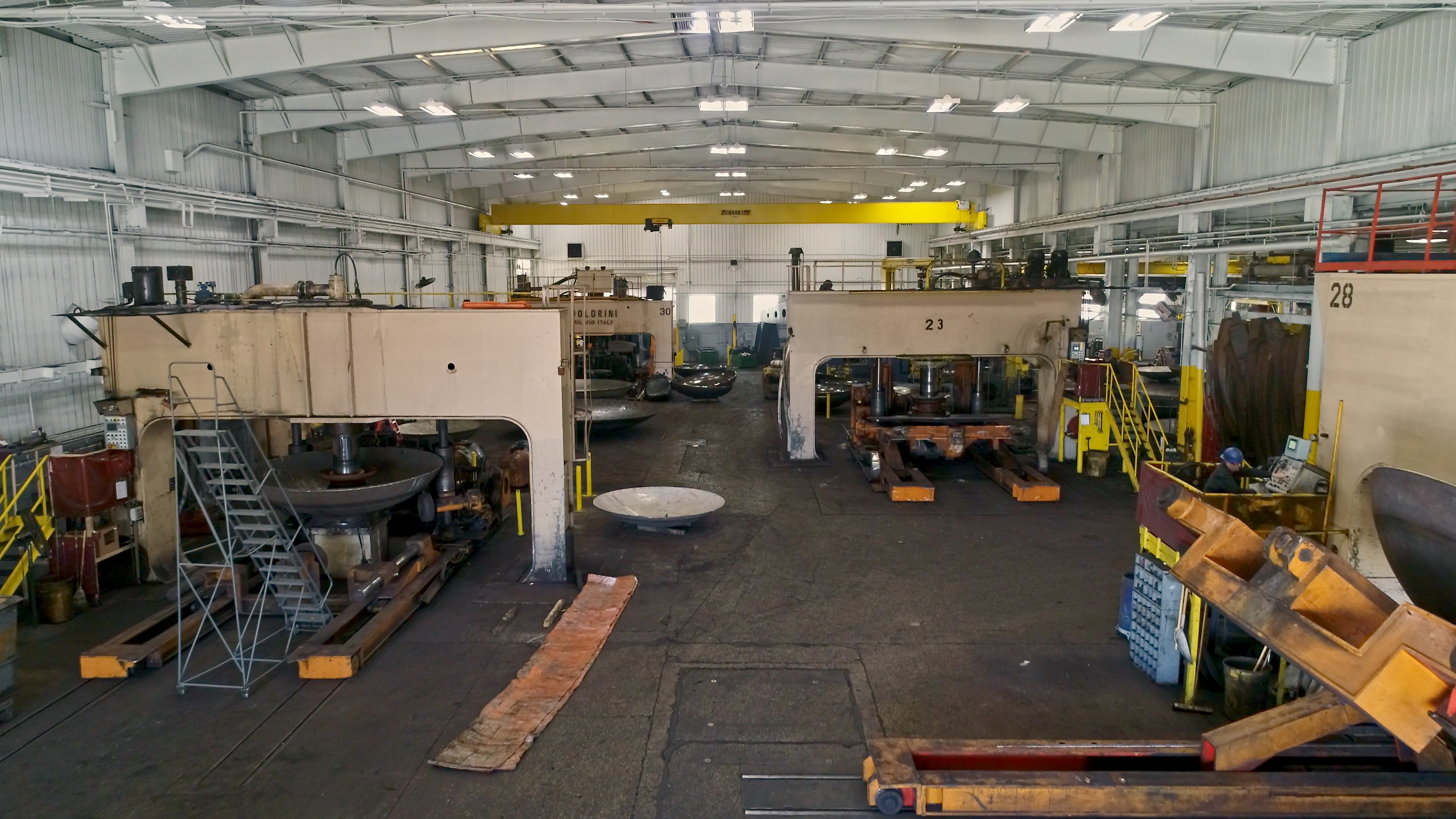 Wide-angle of the inside of a tank and vessel heads shop.