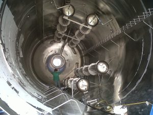 Man welding internals on a fermentation bioreactor